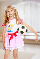 Girl playing with soccer ball