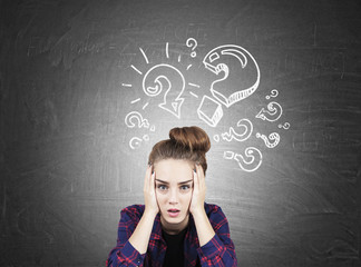 Girl and attacking question marks