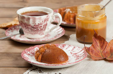 Homebaked Cake, Acorn Shape. Cup Of Tea. Toffee Souce.