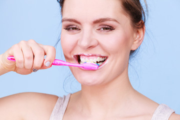 Woman brushing cleaning teeth