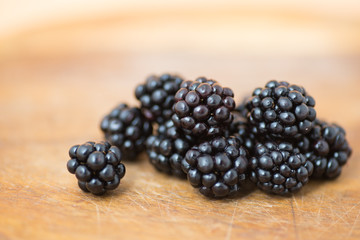 Ripe blackberries on cutting board