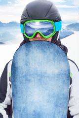 Close up Portrait of snowboarder in Carpathian Mountains, Bukovel Snowboarder. A mountain range...