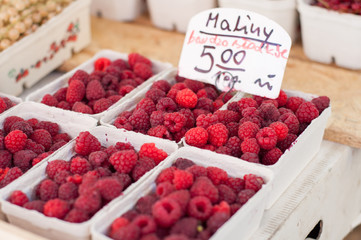 Organic ripe raspberries on fresh market