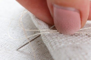 Lien fabric with needle and thread