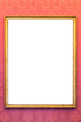 Empty golden picture frame on the wall