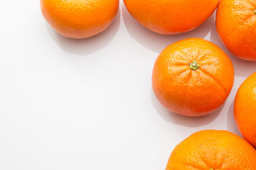 Orange citrus fruit on a white background.