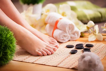 Foto op Canvas Image of SPA pedicure on bamboo surface © Maksymiv Iurii
