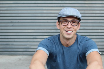ortrait Of Male Designer Sitting Outside Modern Office