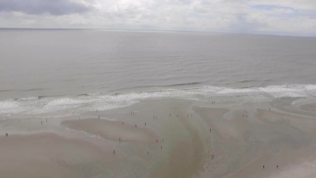 aerial view of waves crashing onto south east atlantic beach
