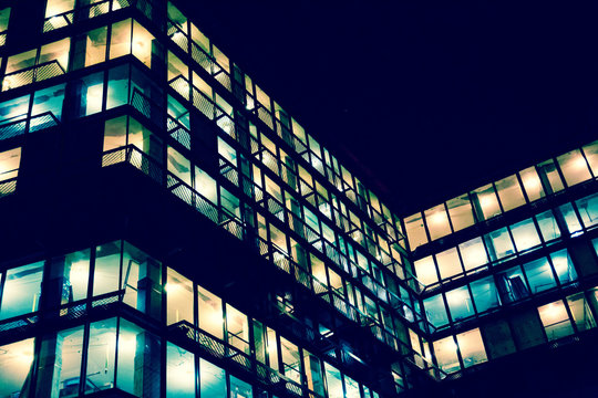 City lights. Abstract architectural concept. Developing construction site lights at night. Developer, residential construction and urban living and lifestyle concept. 