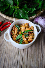 Stir Fried Basil Cicken with Rice and Egg on wooden, Thai Famous