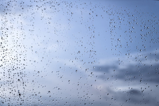 Rain / Water drop of rain on glass with outdoor background