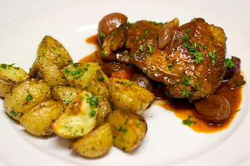 Chicken Coq Au Vin served with baked baby potatoes
