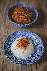 Thai Dried Shredded Pork on Blue Plate and Wood Backgroound, Tha