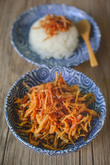 Thai Dried Shredded Pork on Blue Plate and Wood Backgroound, Tha