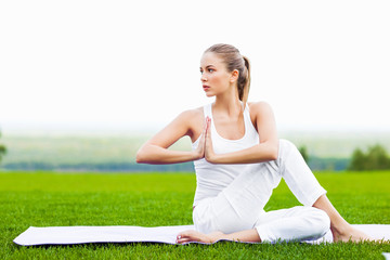 Young girl doing yoga outdoor