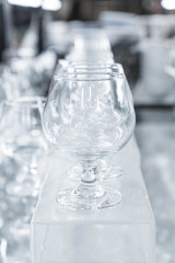 Many empty glasses in a line