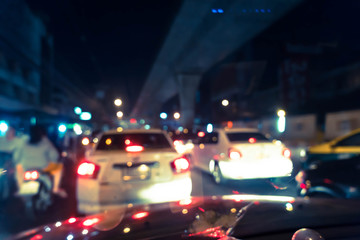 Fototapeta na wymiar Blurred traffic jam on rush hour time, shooted from inside of ca
