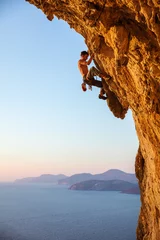 Foto op Plexiglas Rock climber on overhanging cliff. Kalymnos Island, Greece. © Andrey Bandurenko