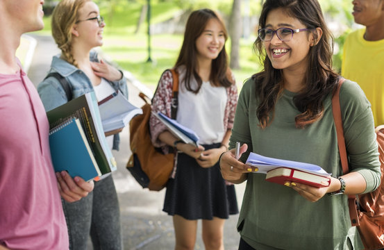 Diverse Young Students Book Outdoors Concept