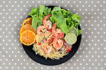 Home made,Spicy sour minced green mango salad with shrimp topped sliced green lemon,Chinese orange and lettuce. 
