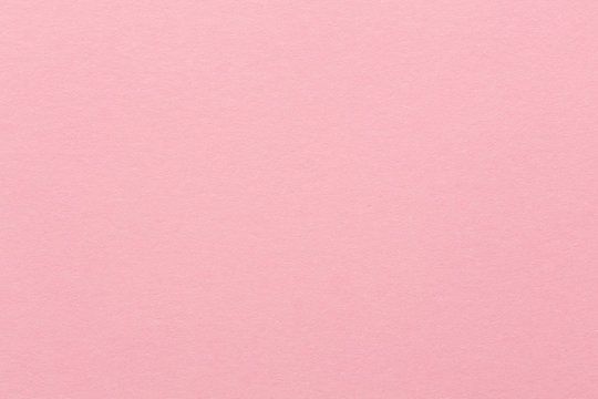 Soft pink paper texture for background usage.