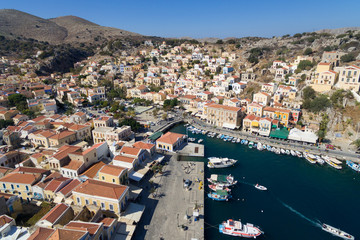 Symi island - Aerial image of Colorful houses and small boats at the heart of the village
