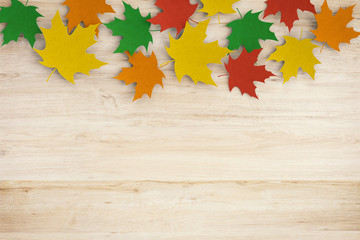 Naklejka na ściany i meble thanksgiving day concept with 3d rendered colourful maples on wooden background