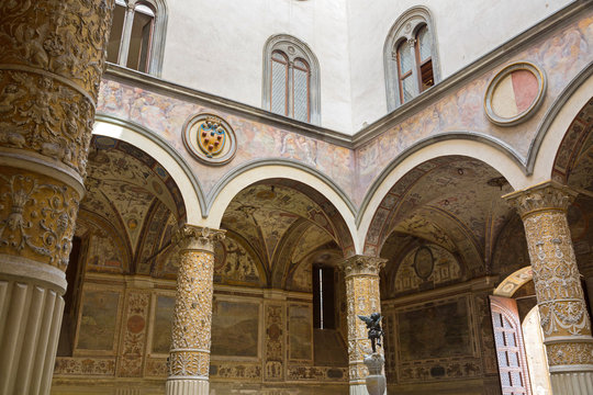Interior details of Old Palace, Palazzo Vecchio’s first Courtyard, town hall of Florence, Italy with Putto cupid fountain in the middle. Frescoes on walls are cities of Austrian Habsburg monarchy