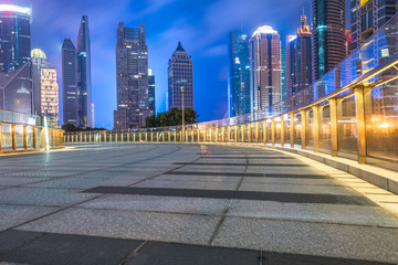 Fototapeta na wymiar empty square with modern building in background at night.