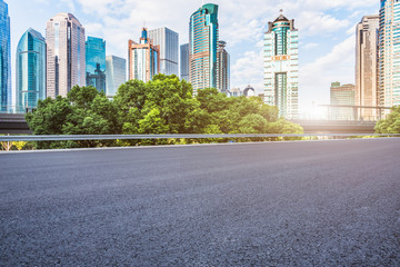 Fototapeta na wymiar empty asphalt road through modern city in China.