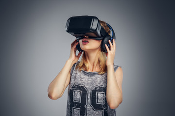 A woman wearing virtual reality glasses.
