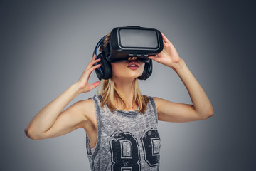 A woman wearing virtual reality glasses.