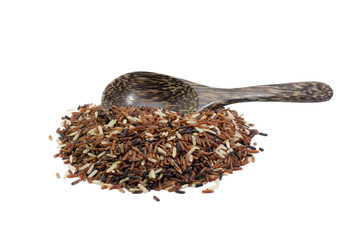 pile of brown rice and wood spoon isolated on white