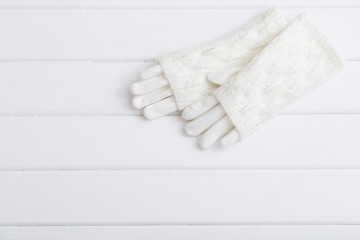 gloves on white wooden background