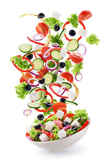 Flying salad ingredients isolated on white background. © vitals