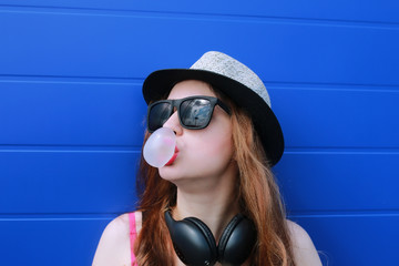 hipster girl at the blue wall