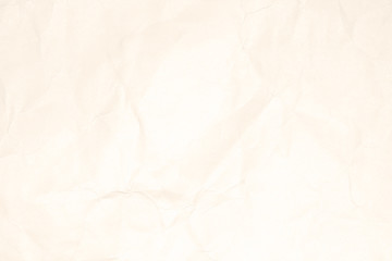 Crumpled light brown paper texture or paper background for design with copy space for text or image.