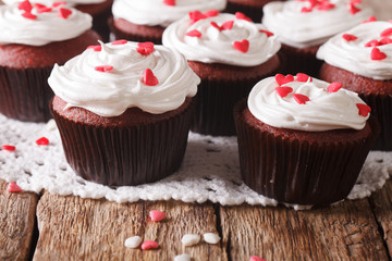 red velvet cupcakes decorated with hearts close-up. Horizontal