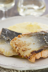 fried salmon with mashed potato on white plate