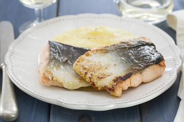 fried salmon with mashed potato on white plate