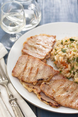 grilled meat with rice on plate