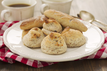 almond cookies on white plate on woden background