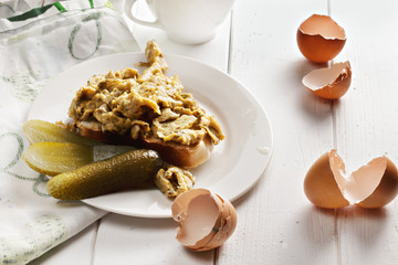 Scrambled eggs and pickled cucumbers