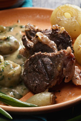 Lamb with onions and mushrooms closeup