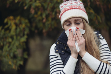  Woman Suffering From Cold outdoor with Tissue