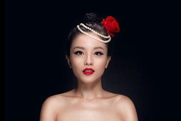 Fashion studio shot of beautiful young asian woman with retro ha