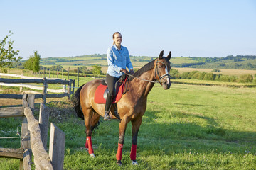 Young woman with her sport horse
