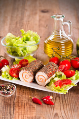 Goat cheese with salad and cherry tomatoes. 