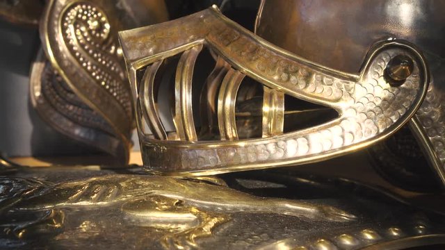 Zoom on a Sicilian puppet' armor including the helmet and shield